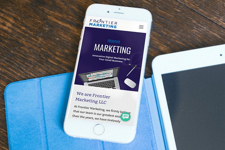 Frontier Marketing’s website and branding redesign displayed on a mobile phone