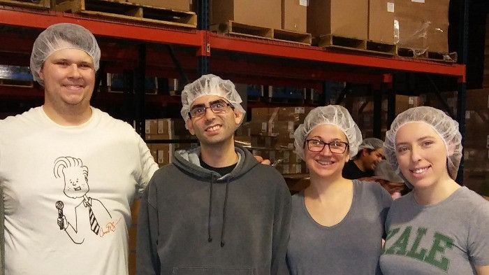 Image of the Frontier Marketing team volunteering at Feed My Starving Children.
