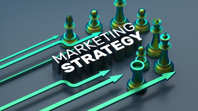 Stylized image of green chess pieces with the label “Marketing Strategy.”