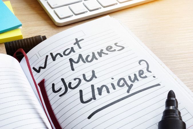 Image of a journal with the words “What Makes You Unique?” written in it.