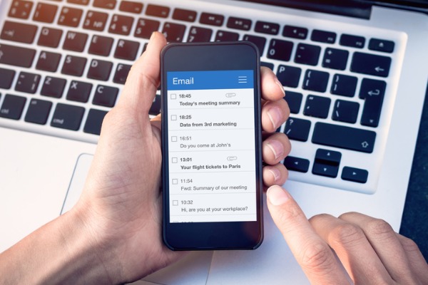 An image showing emails listed on a smart phone as one of the tools for remote workers to stay connected to customers.