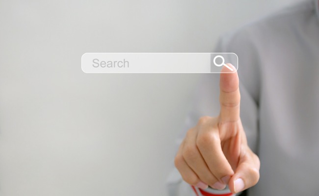 Image of a woman toucing a search box for search engine optimization