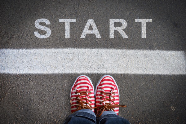 An image showing sneakers behind a white chalk line with the word “Start” in front of it.