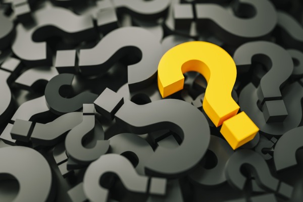 A graphic image showing many black question marks and one orange question mark. 